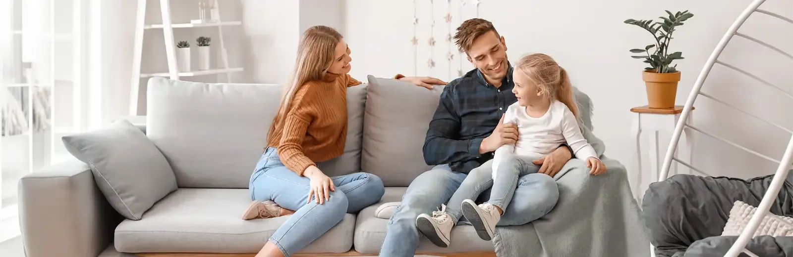 family sitting on couch